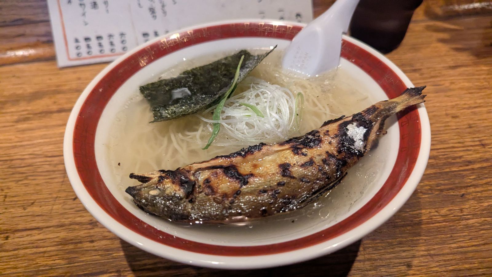Ayu ramen bowl with whole grilled sweetfish