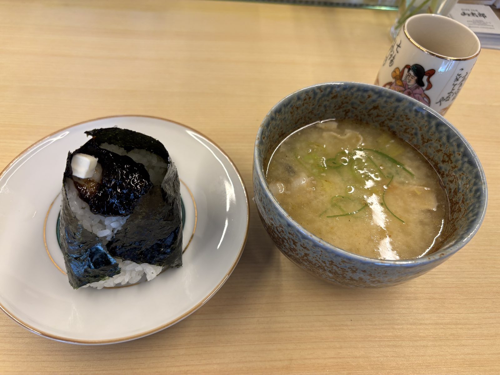 Freshly made onigiri and a bowl of tonjiru at Yamataro